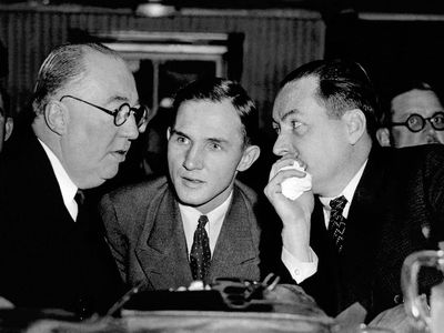 Bruno Richard Hauptmann (center) consults with his laywers during pretrial court proceedings on September 20, 1934.