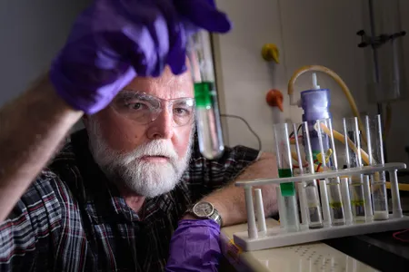 Dr. John Cushman with the flow battery