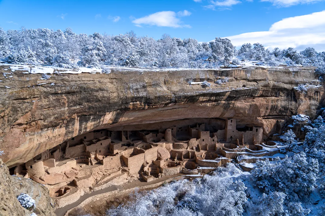 Functioning as an awning, the overhang of cliffs at Mesa Verde National Park prevents snow from falling on these ancient Native dwellings