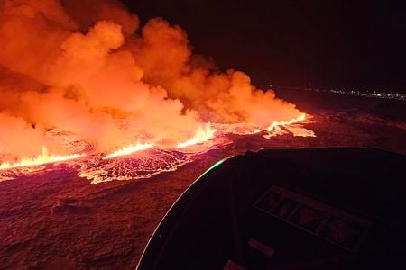 A volcano erupts near the evacuated town of Grindav&iacute;k in southwestern Iceland.