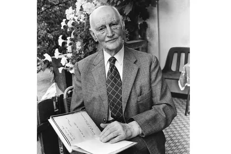 Otto Frank pictured holding a copy of "The Diary of Anne Frank"