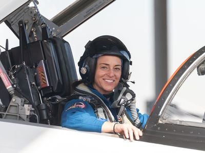 Nicole Mann poses for a portrait in a T-38 trainer jet at Ellington Field in Houston, Texas, in 2018.