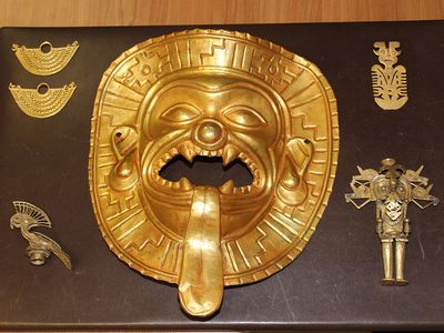 A gold Tumaco mask found among gold figurines and ancient jewelry recovered at Madrid's Barajas airport