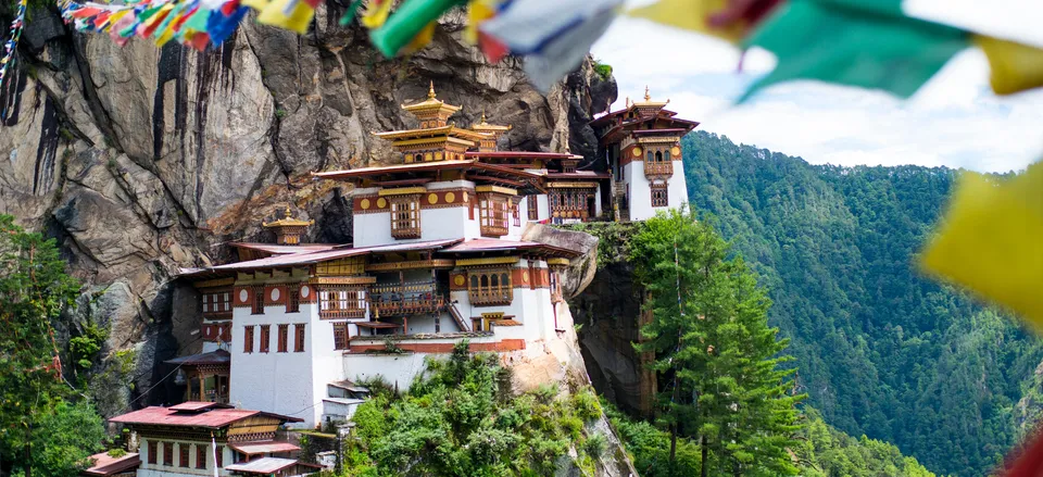  Cliff-side Taktsang Monastery with prayer flags, Bhutan 