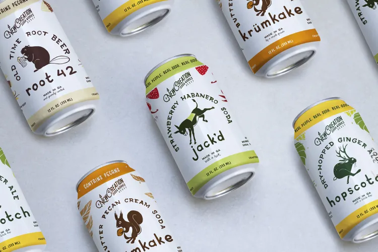 New Creation Soda Works cans