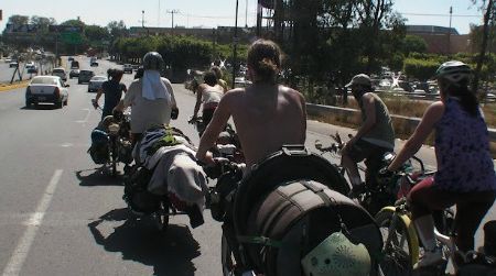 The Ginger Ninjas on the move in Guadalajara, Mexico. Where buses and airplanes would provide the horsepower for other touring bands, the Ginger Ninjas go by bicycle.