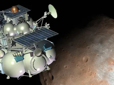 Russian scientists have recently improved their probe by replacing the drill shown with a scoop device to collect soil in the weak gravity of Phobos, the larger of Mars’ two moons.
