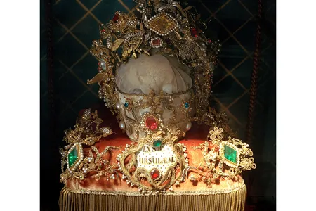 A skull believed to have belonged to a companion of St. Ursula. The bones of other saints are said to lie under the gemstones and gold fabric.