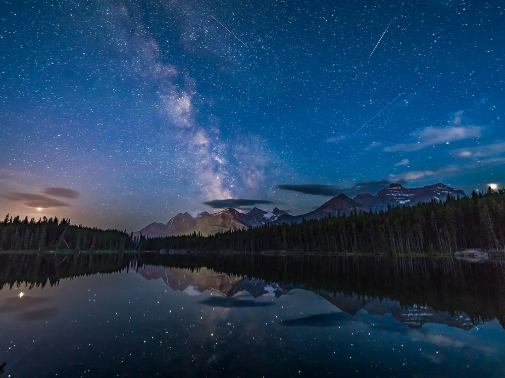 A view of the night sky looking south at Herbert Lake, Banff National Park, Alberta, shows the Milky Way over Mount Temple