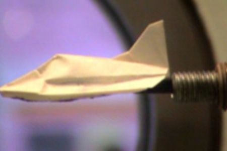 Testing a small-scale prototype of the space paper airplane in the University of Tokyo's hypersonic wind tunnel.