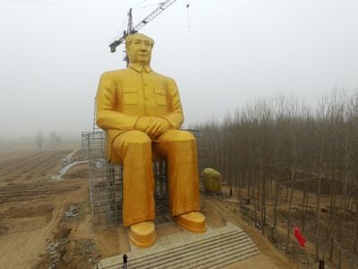 A gold-painted statue of Chairman Mao has been erected in a remote part of central China. 