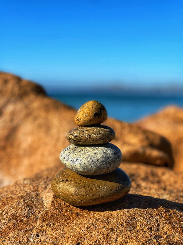 A cairn built on the rocks while walking in a beach in San Jose del Cabo thumbnail