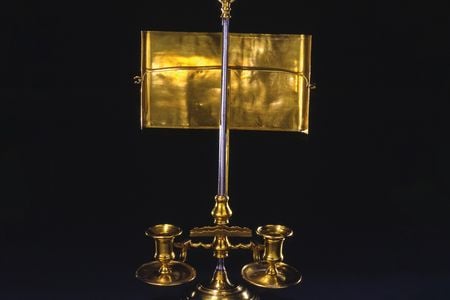 George Washington used the light of this brass candle stand while laboring over his farewell address in 1796.