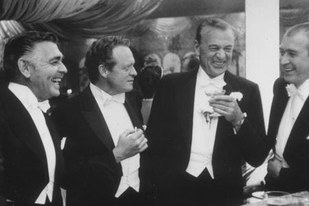 A Mount Rushmore of stardom: Gable (left) cracks a joke at the photographers expense with friends Heflin, Cooper and Stewart.