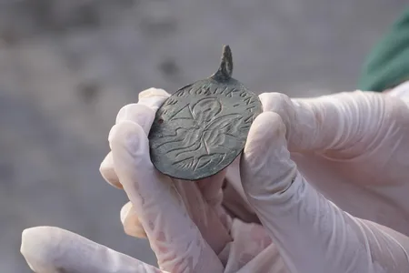 The amulet contains an image of King Solomon and a Greek inscription that reads, "Our Lord defeated evil."