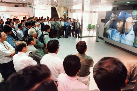 Tokyoites watch Hideo Nomo pitch for the Los Angeles Dodgers at Sony Plaza on June 30, 1995.