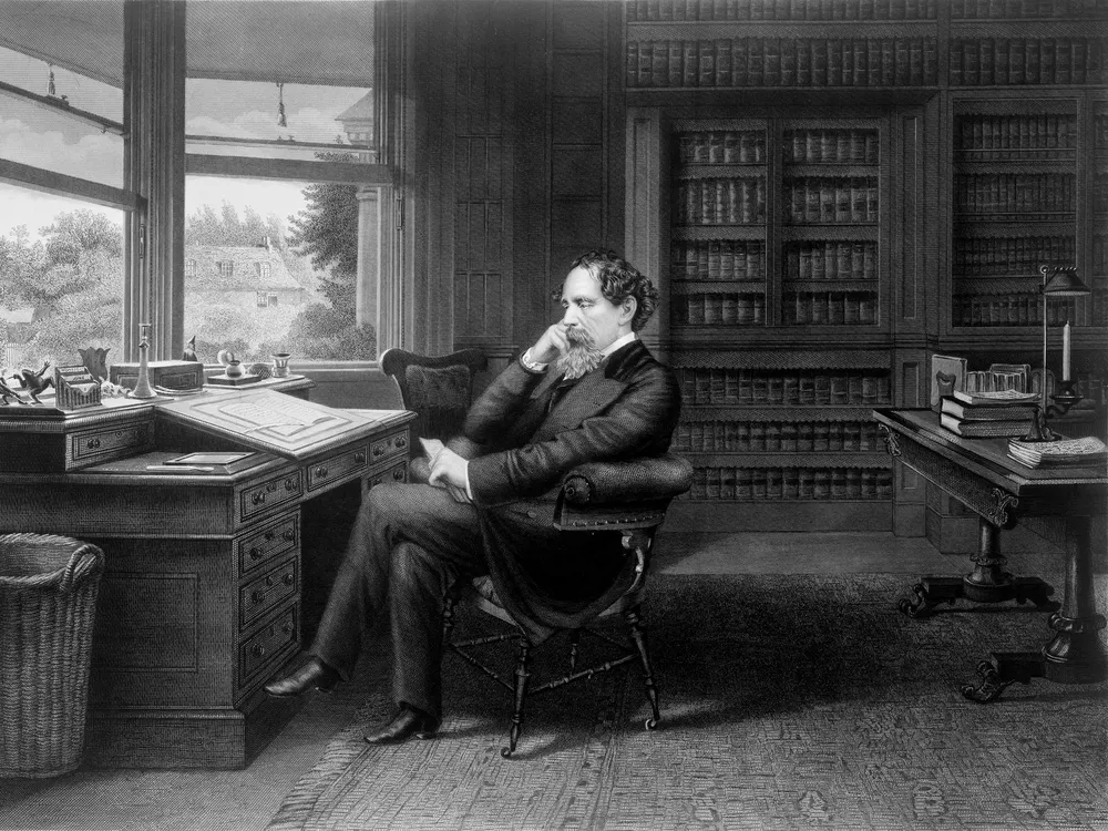 Charles Dickens in his study