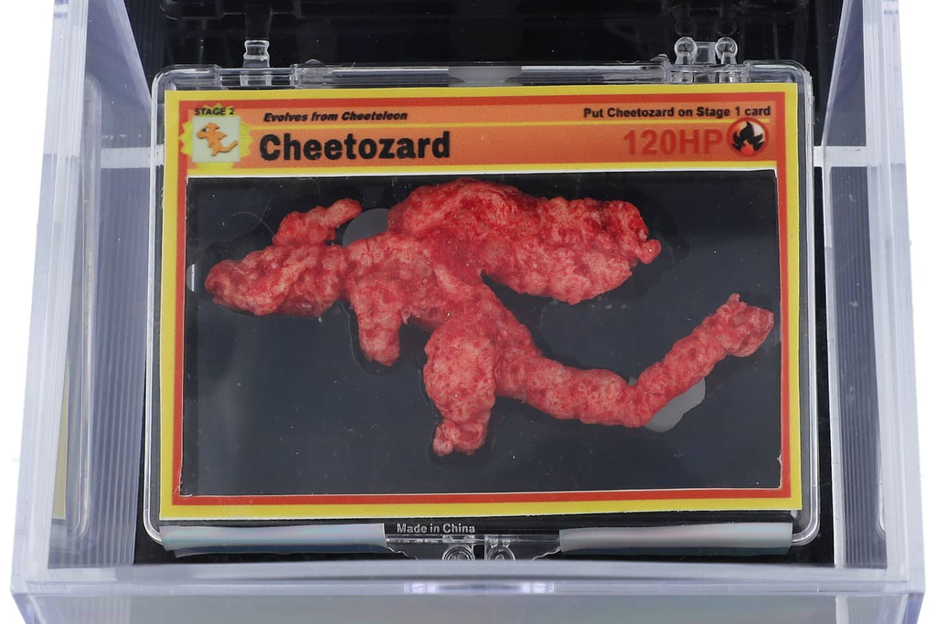 Red Cheeto in a transparent case against black backdrop