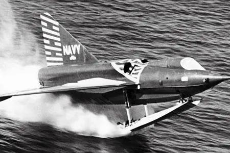 A Sea Dart takes off from San Diego Bay on a single ski, a design tested later in the program; earlier models used twin skis.