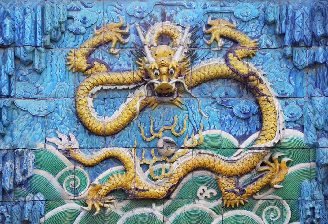 One of the nine dragons depicted on a wall relief in China