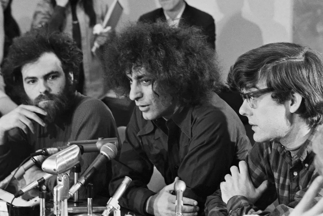 Jerry Rubin, Abbie Hoffman and Rennie Davis talk to reporterrs