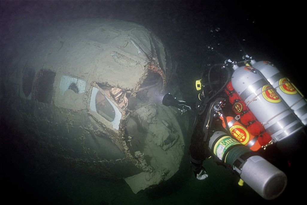 NPS Archeologist examining nose damage2[8].jpg