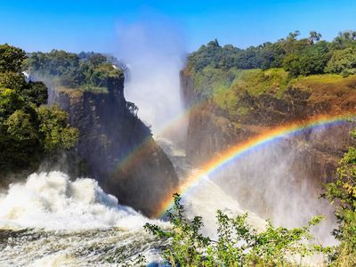 A rainbow can be spotted in the mists of Victoria Falls in Zimbabwe. What better way to celebrate Earth Day than with an exploration of the planet's most colorful places? 