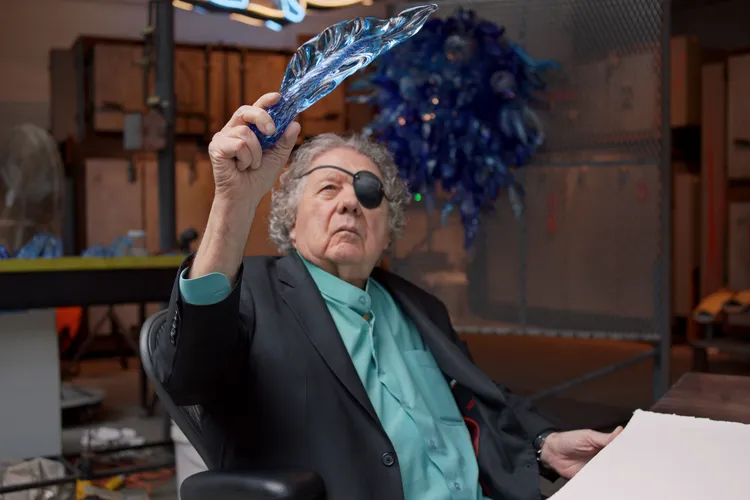 Dale Chihuly looking at glasswork