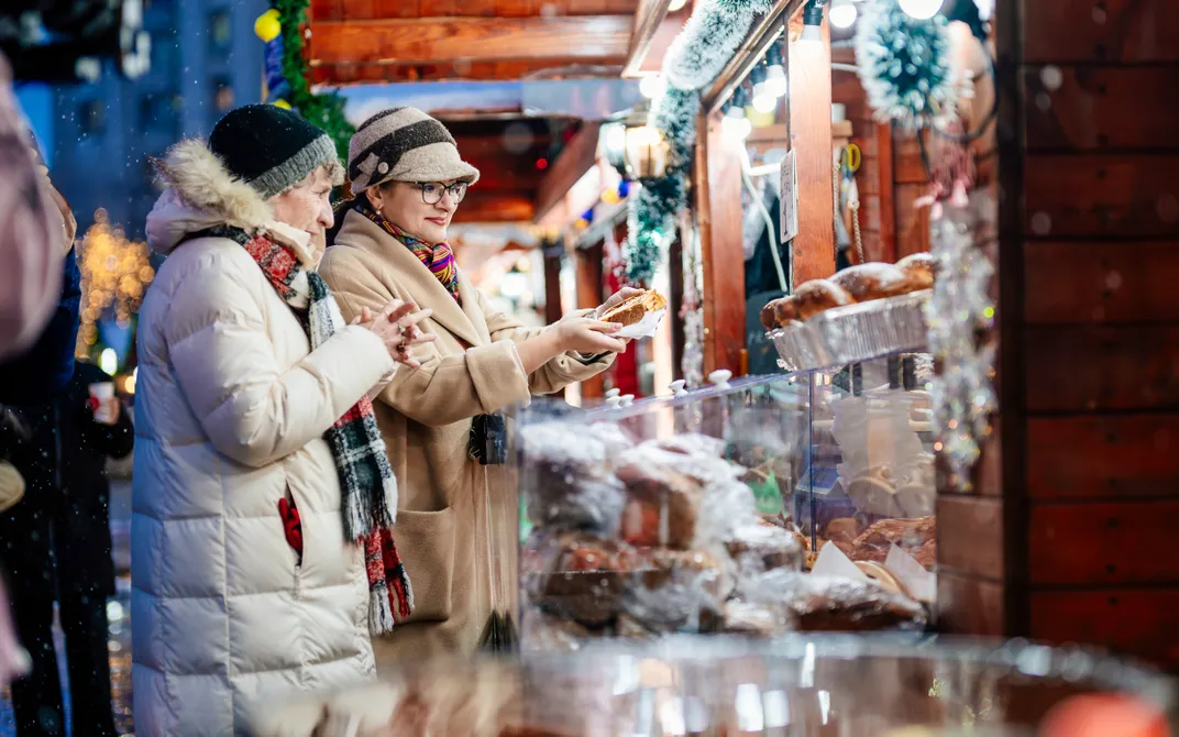 Enjoying traditional food at a Christmas market. Credit: AMA Waterways