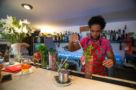 A bartender mixes a drink at O'Reilly 304.