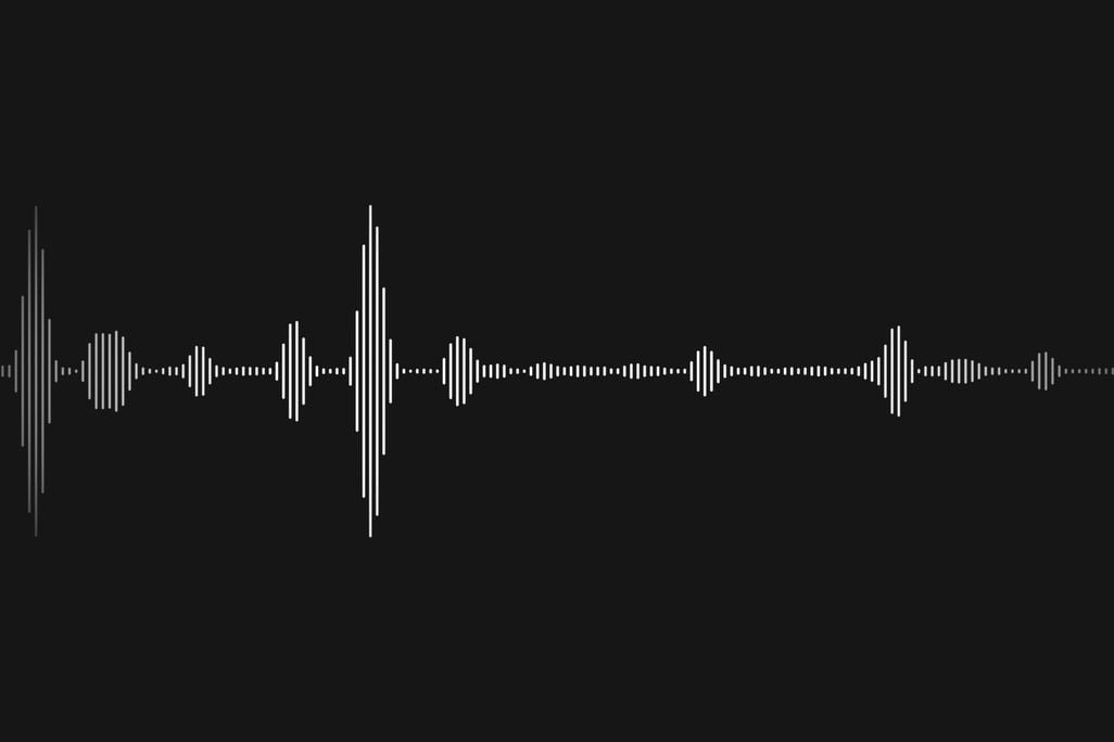 A visual of blips of sound waves on a black background