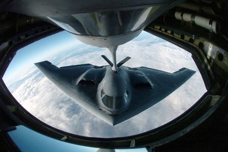 A B-2 Spirit bomber refuels from a KC-135 Stratotanker during a deployment to Andersen Air Force Base, Guam.  The bomber deployed as part of a rotation that has provided U.S. Pacific Command officials a continuous bomber presence in the Asia-Pacific region, enhancing regional security and the U.S. commitment to the Western Pacific. The B-2 is from the 509th Bomber Wing at Whiteman AFB, Mo. The KC-135 is assigned to the Illinois Air National Guard's 126th Air Refueling Wing at Scott AFB, Ill.  (U.S. Air Force photo/Master Sgt. Val Gempis)