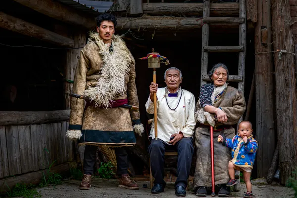 Heritage in Front of the Wooden House thumbnail
