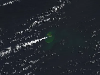 A NASA Earth Observatory satellite captured an image of the eruption on September 14. The greener, discolored water near the eruption site likely contains particulate matter, rock fragments and sulfur from the volcano.&nbsp;