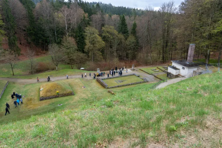 Visitors lay wreaths at the “Square of Nations,” a memorial site at the former Flossenbürg concentration camp’s crematorium, on April 24, 2022.