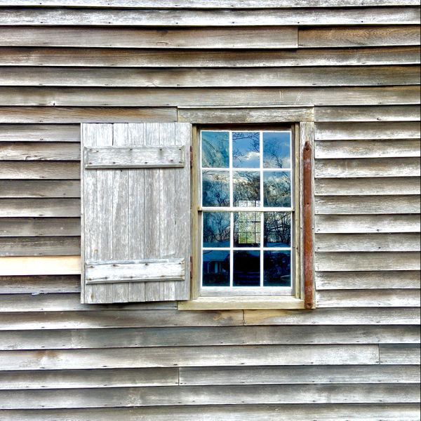 Rustic window with clouds in the window panes. thumbnail