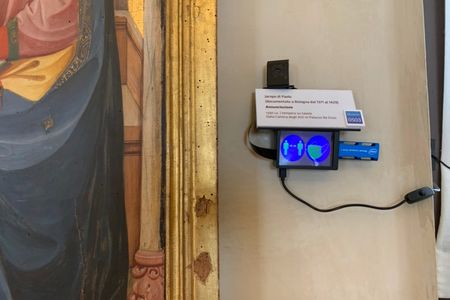 This small device flashes red if a visitor gets too close to an artwork or fails to wear their face mask correctly.