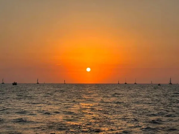 Sunset while sailing around Santorini thumbnail