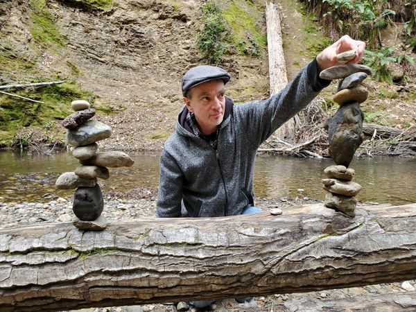 A Rock Wizard Doing a Rock Balance in Memorial Park thumbnail