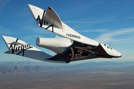 The Virgin Galactic SpaceShip2 (VSS Enterprise) glides toward Earth on its first test flight after being released from its WhiteKnight2 (VMS Eve) mothership over Mojave, California October 10, 2010. The craft was piloted by engineer and test pilot Pete Siebold from Scaled Composites.