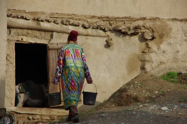 A woman carrying water buckets thumbnail