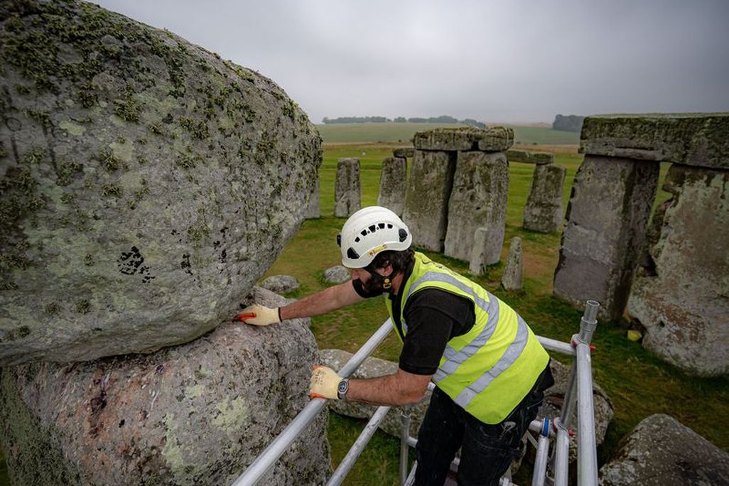Conservator examines megalith at Stonehenge
