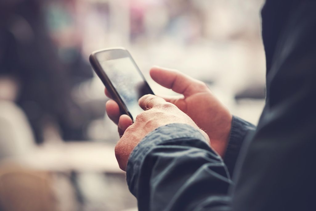 man holding cell phone.jpg