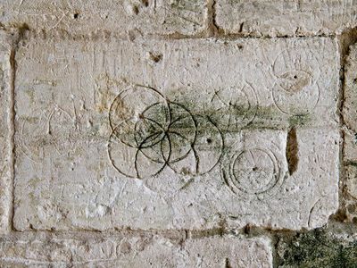 These daisy wheels were found in Saxon Tithe barn in Bradford-on-Avon. 
