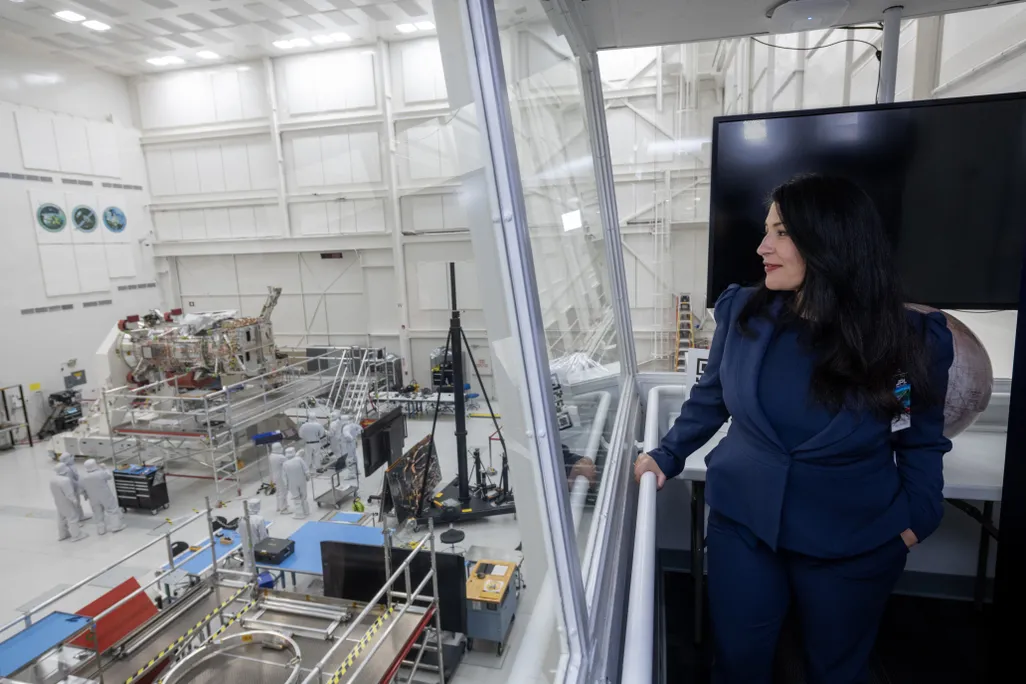 U.S. poet laureate Ada Limón watches the Europa Clipper being built