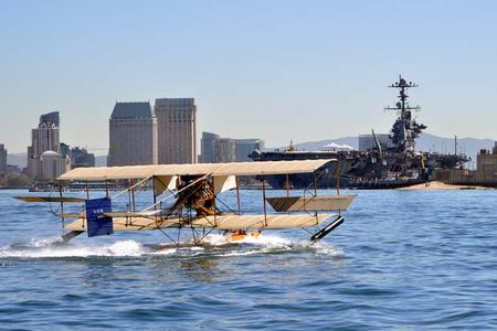 110211-N-2688M-142
SAN DIEGO (Feb. 11, 2011) A functional replica of a Curtiss A-1 Triad seaplane skims the water in San Diego Bay in front of the aircraft carrier USS John C. Stennis (CVN 74) during a demonstration at Naval Air Station North Island. The A-1 Triad was the first Navy plane purchased by the Navy. The A-1 Triad was the first plane purchased by the Navy. The A-1 Triad replica is taking part in the Centennial of Naval Aviation Open House and Parade of Flight event on Feb. 12. The Navy is observing the Centennial of Naval Aviation with a series of nationwide events celebrating 100 years of heritage, progress and achievement in naval aviation. (U.S. Navy photo by Mass Communication Specialist 2nd Class Joseph Moon/Released)