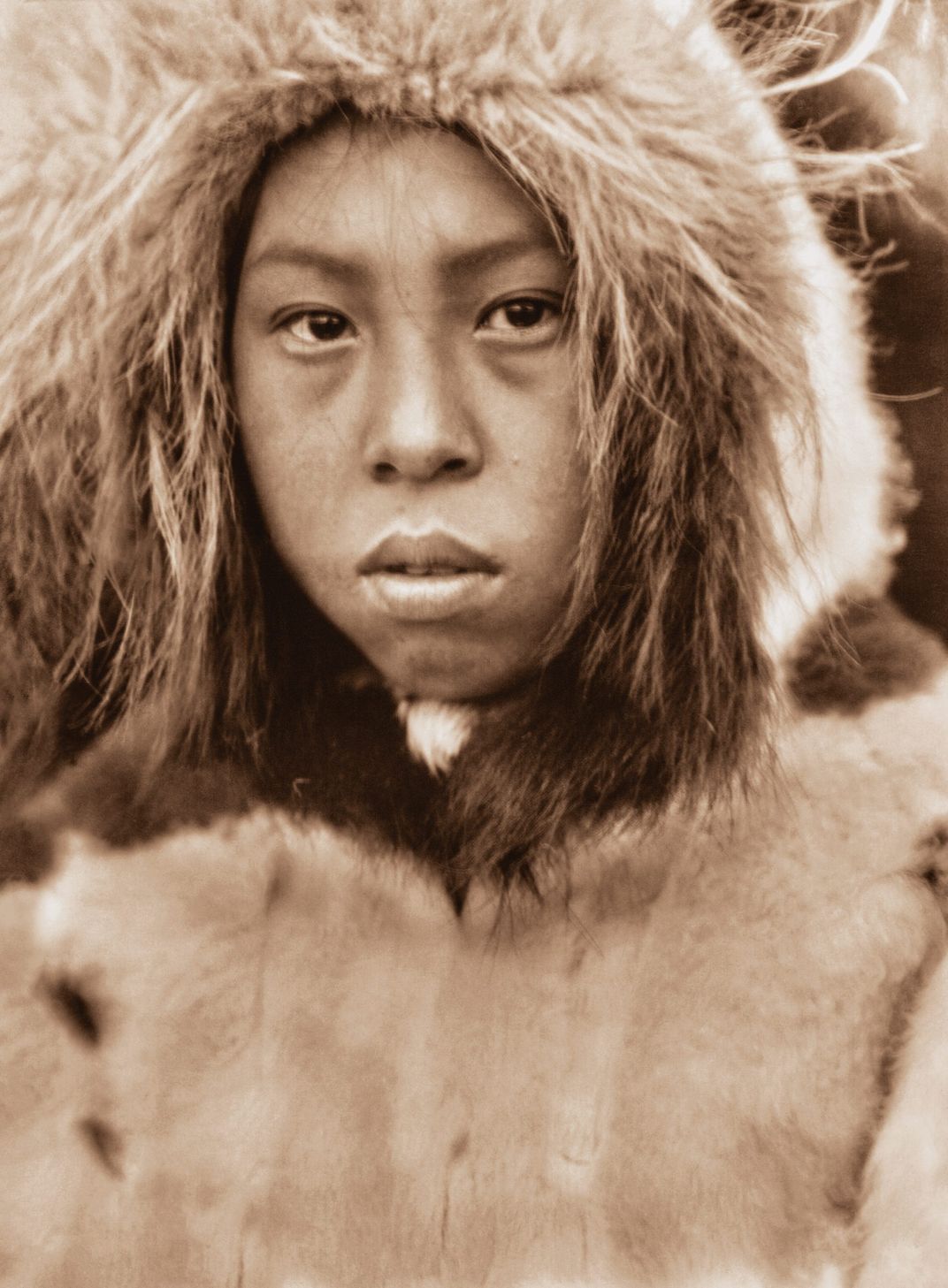 Kilk-ni-sik, in white fur parka, Cape Prince of Wales