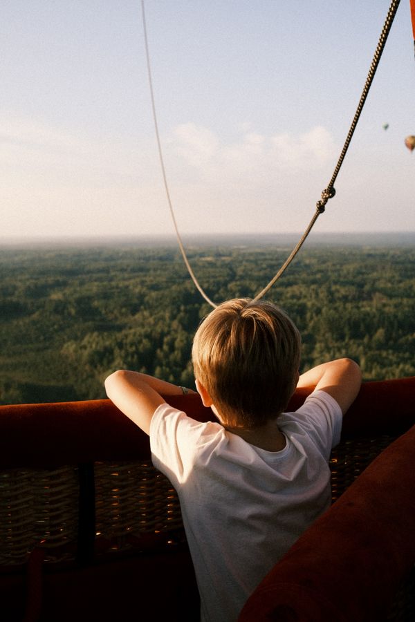 Child Looking Over Vilnius from an Air Balloon thumbnail