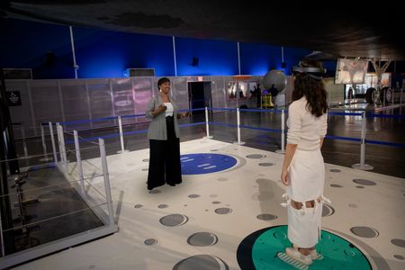 In the installation, astronaut Mae Jemison appears as a 3D rendering (above, left) and discusses her career and those of other women involved in the space program. 