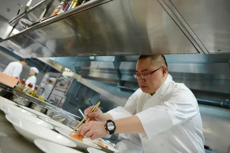 Tony Lu prepares a dish.